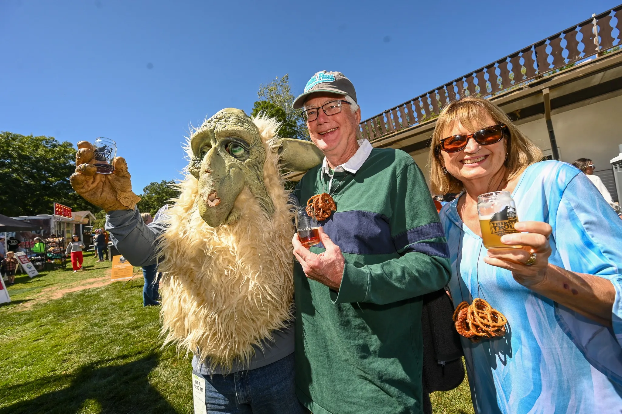 Couple with troll in front of vendors
