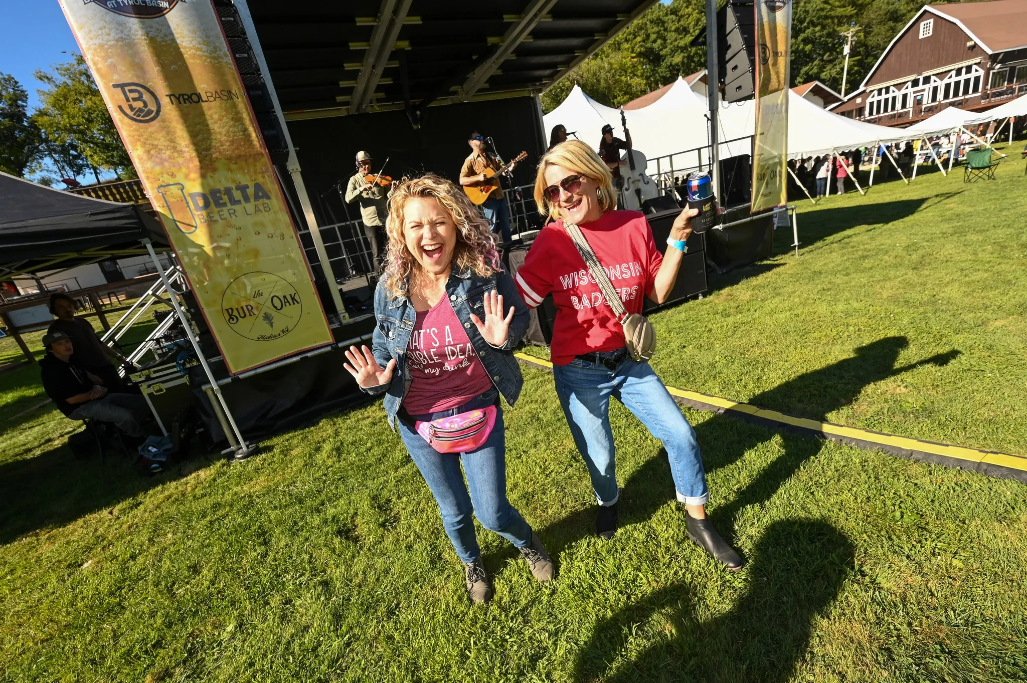 Two people having fun in front of the stage