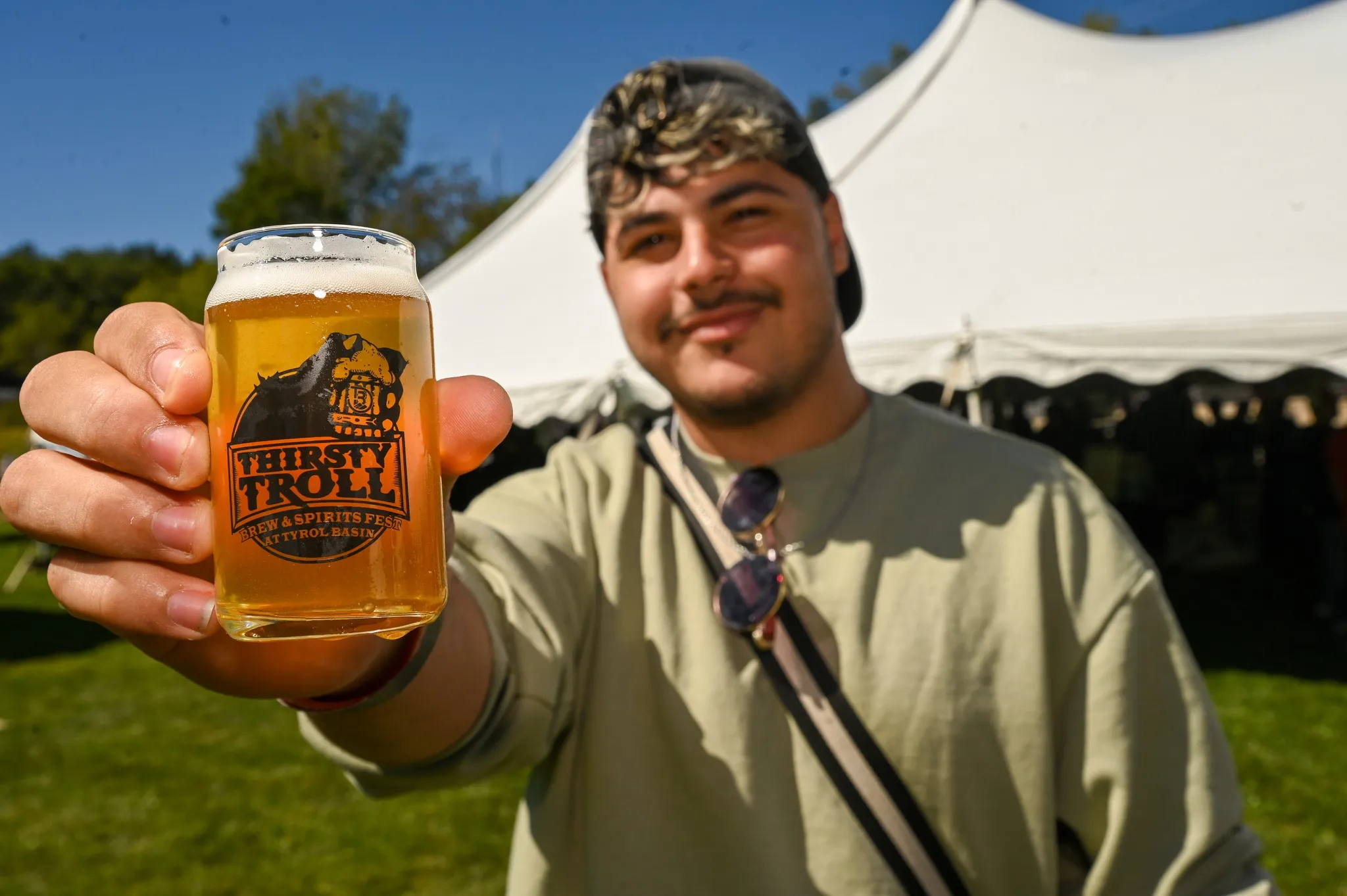 Guest showing off 'Thirsty Troll' glass sampler